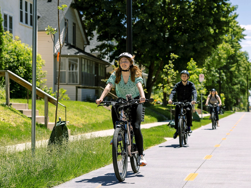 Bicyclists on a street. Bicyclists on a street.