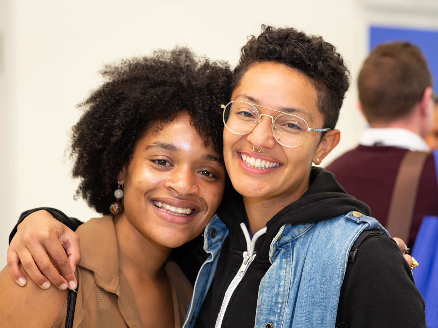 two people smiling