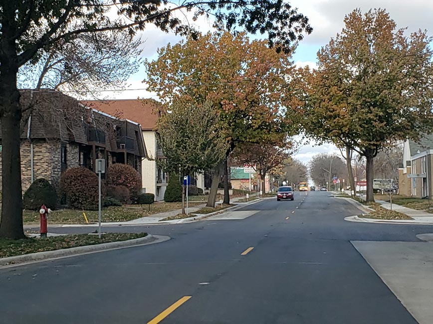 Photo of 34th Ave. with smooth, clean pavement after construction