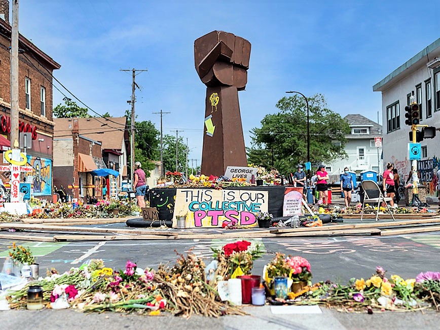 Symbolic raised fist protest sculpture in the intersection where George Floyd died.