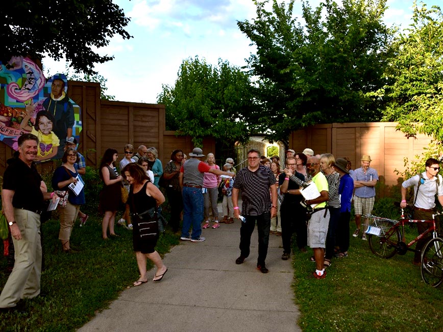 A group gathers for the 38th Street Walking Tour.