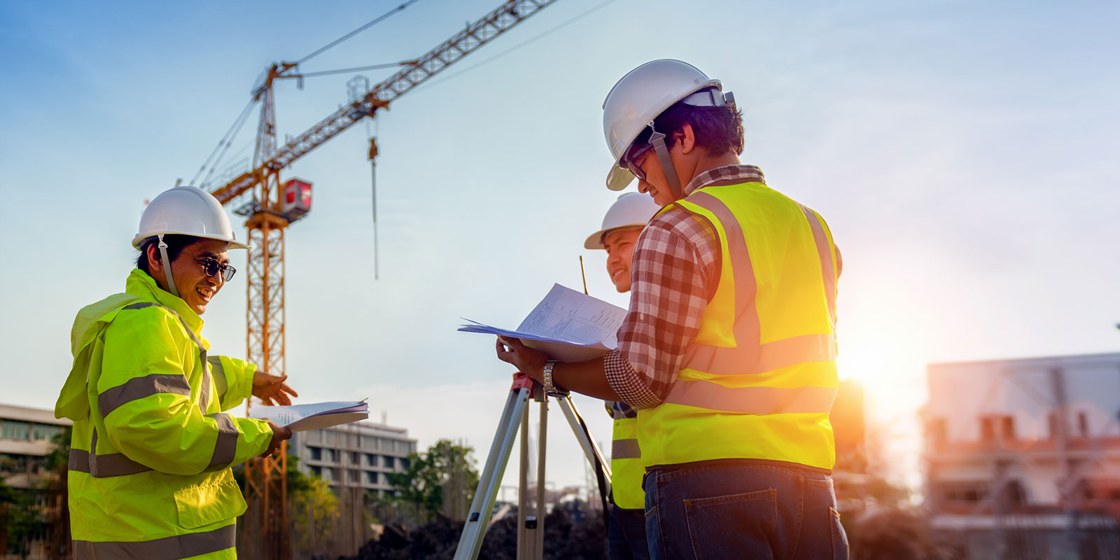 construction workers by crane