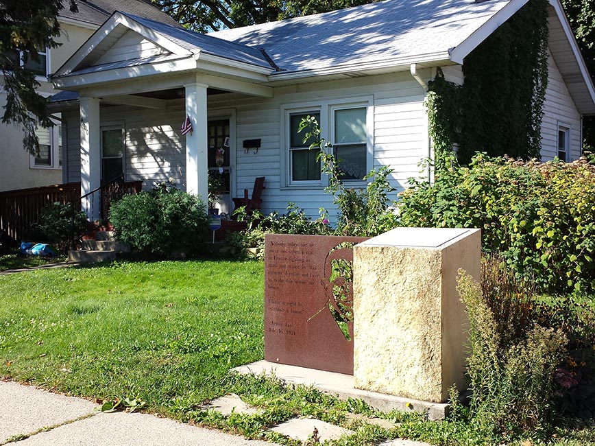 Arthur and Edith Lee House on National Register of Historic Places. A quote is inscribed on the sculpture in yard: Nobody asked me to move out when I was in France fighting in mud and water for this country. I came out here to make this house my home. I have a right to establish a home. – Arthur Lee July 16, 1931