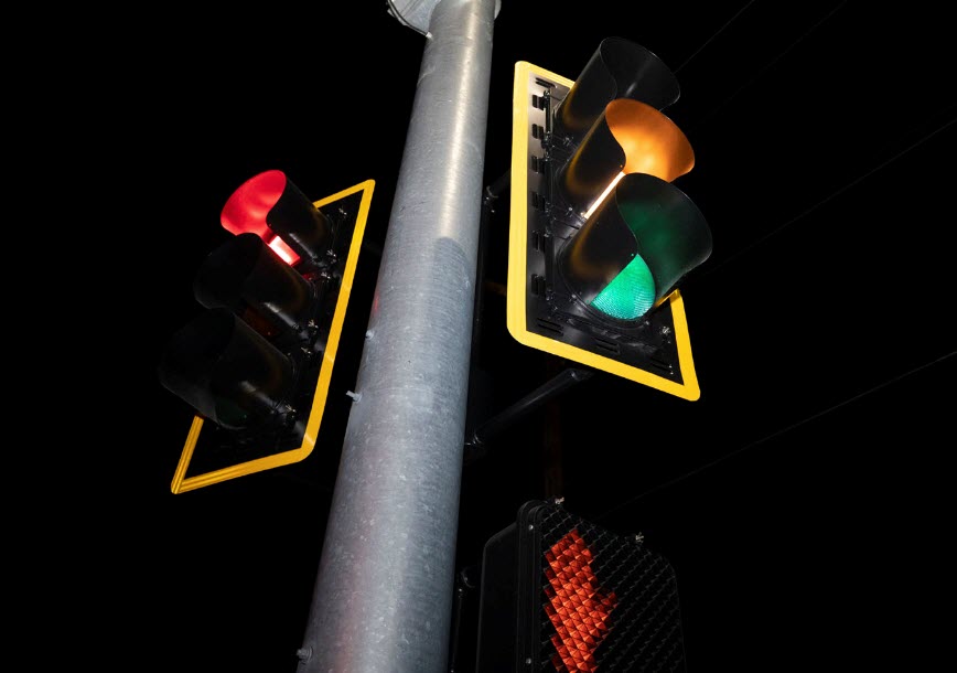 Retroreflective backplate - Backplates added to a traffic signal improve the visibility of the illuminated signal in both day and nighttime conditions