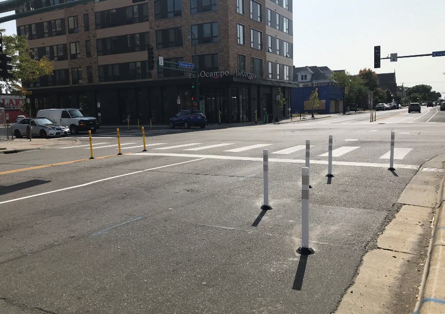 Bumpouts - Reduces the crossing distances for people walking and rolling; Improves sight lines between people driving and people crossing the street.
