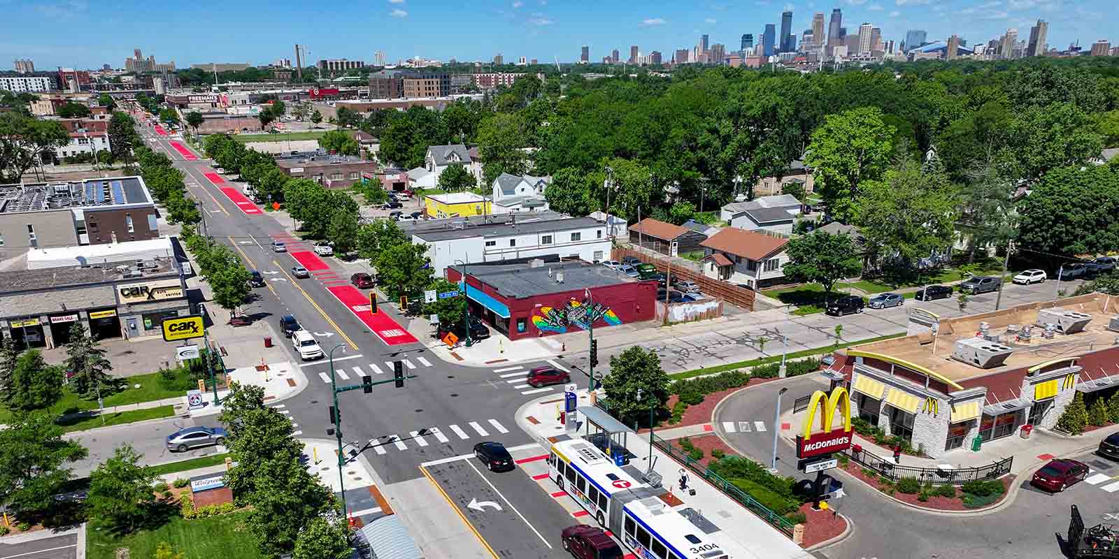 An aerial image of a Metro Transit bus on a red bus lane along East Lake Street An aerial image of a Metro Transit bus on a red bus lane along East Lake Street