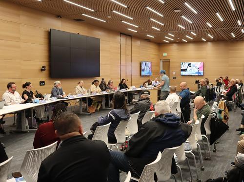 People at a public hearing of the Community Commission for Police Oversight