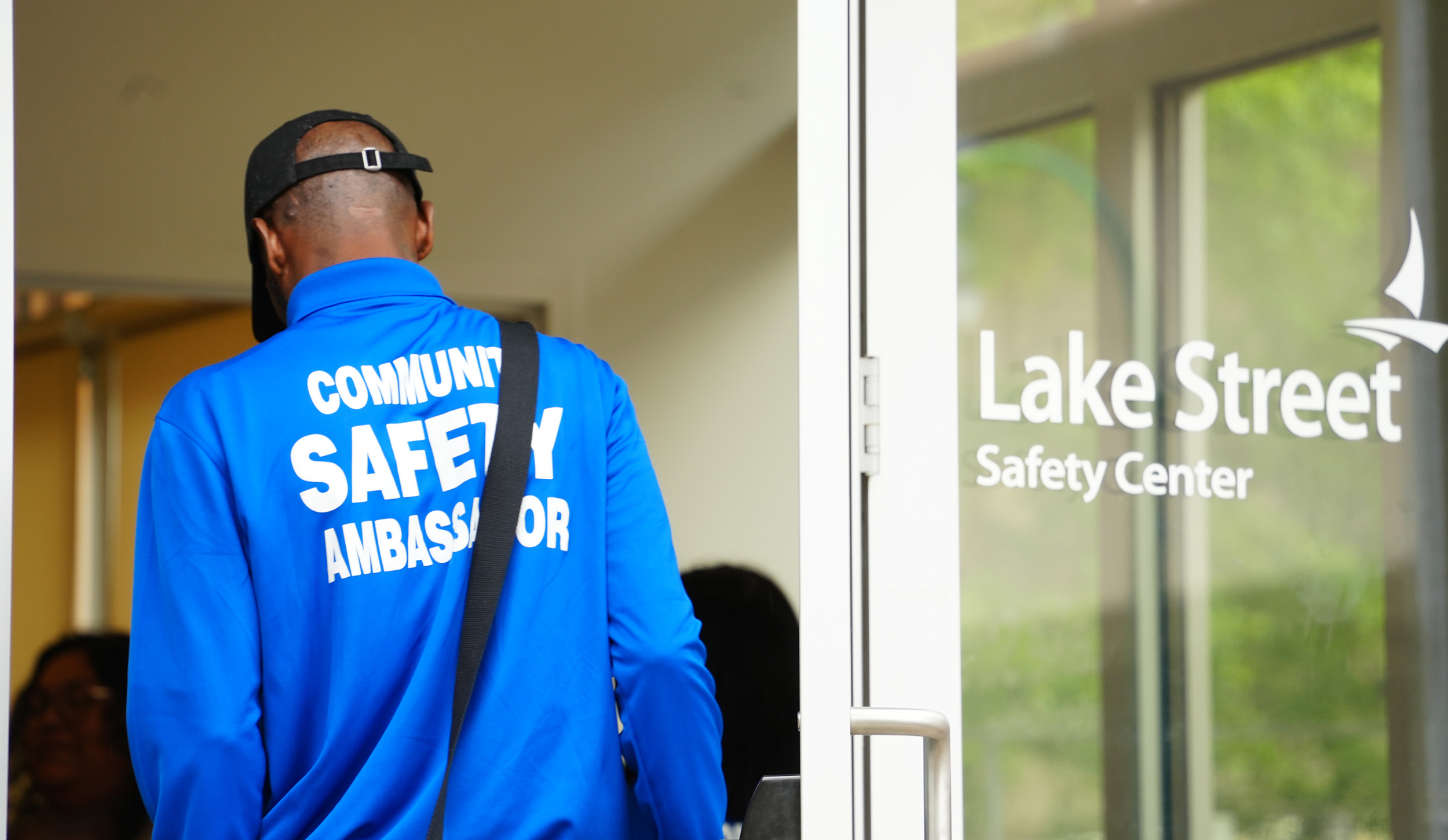 A safety ambassador entering the Lake Street Safety Center.