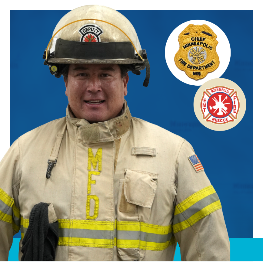 Deputy Fire Chief wearing tan uniform with helmet and badges that say Chief Minneapolis Fire Department MN and Minneapolis EMT Fire Rescue