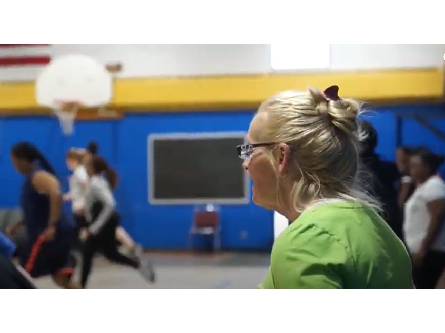 Woman observing women running in a gym