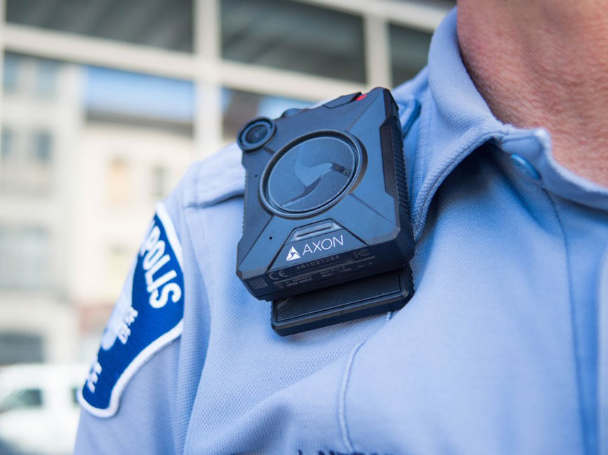 A body worn camera attached to a police officer's shoulder