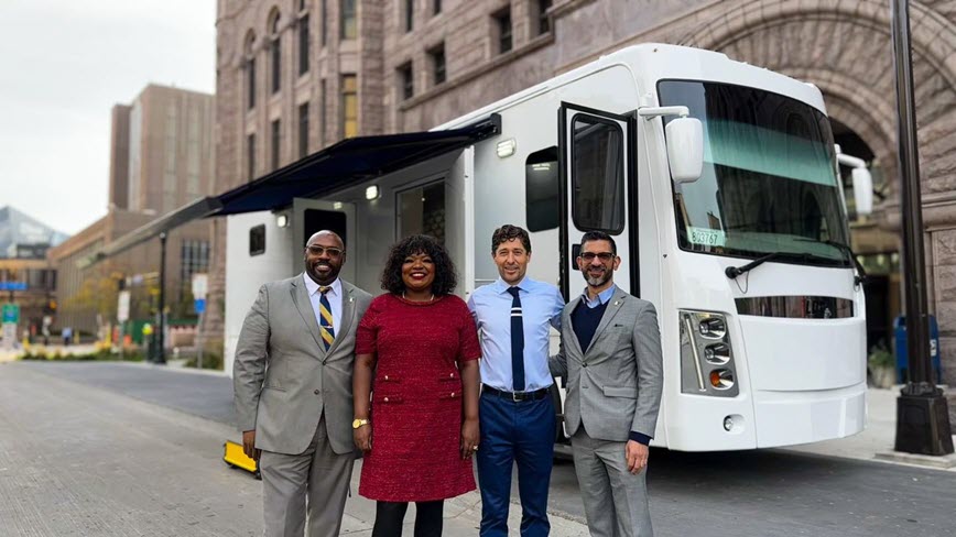 Mayor Frey and others standing by a health mobile unit.