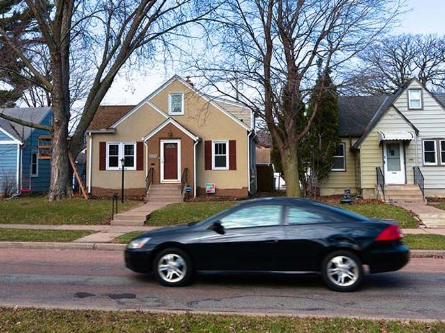 Car driving through Minneapolis neighborhood