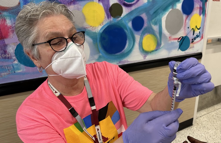 Health care worker preparing mpox vaccine Health care worker preparing mpox vaccine