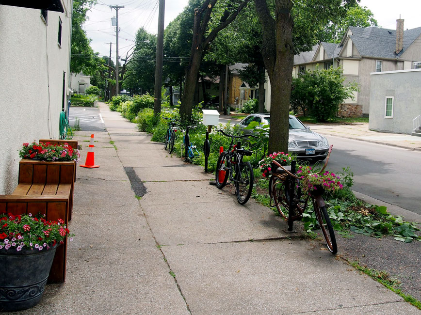 Minneapolis sidewalk with flowers and bikes Minneapolis sidewalk with flowers and bikes
