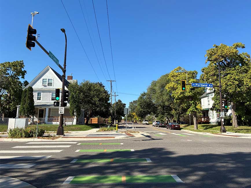 Intersection with bikeway markings and housing on the corner Intersection with bikeway markings and housing on the corner
