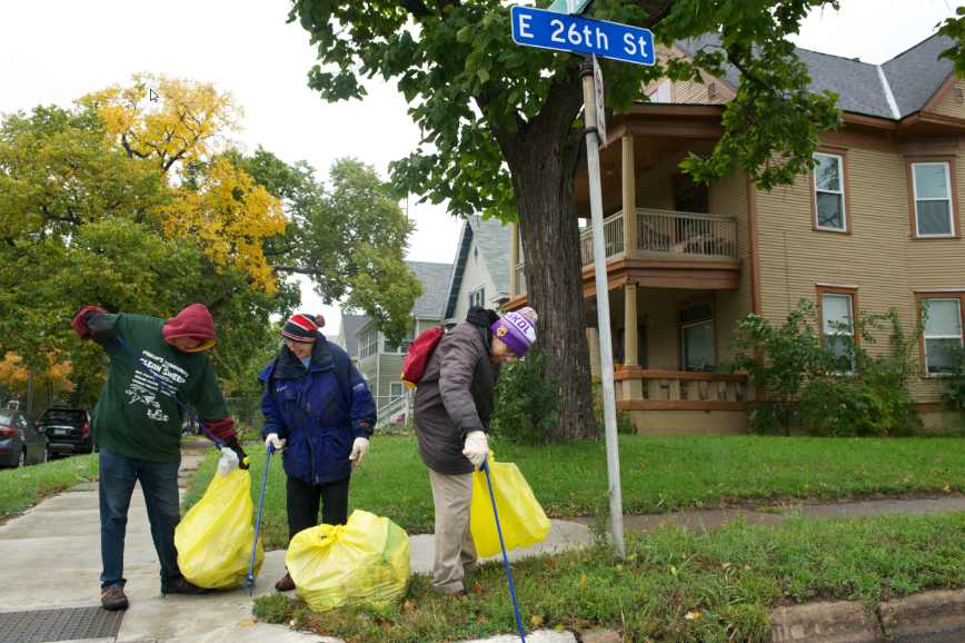 people cleaning up litter, yellow litter bags, litter grabbers