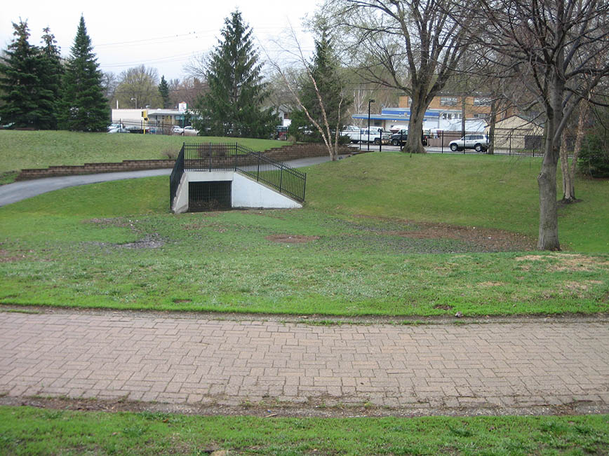 A green space pond with no water A green space pond with no water