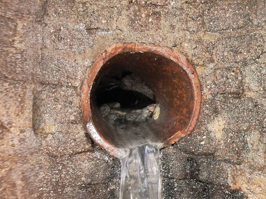 Storm maintenance hole being installed.