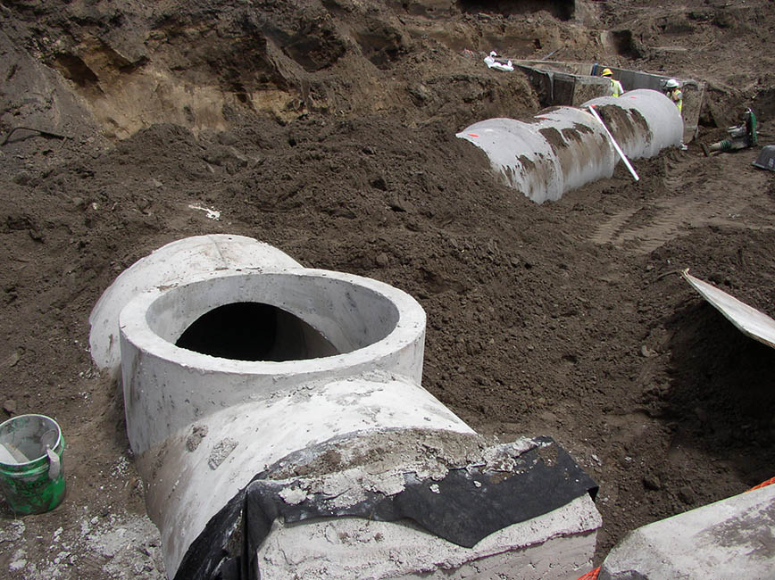Sewer structure being installed. Sewer structure being installed.