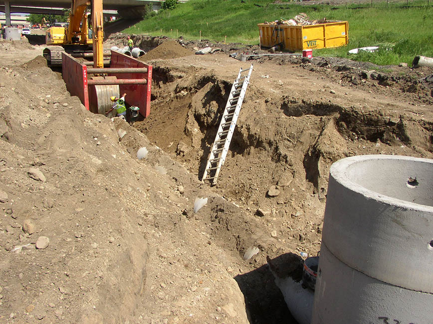 Lots of dirt in photo, underground utility installation