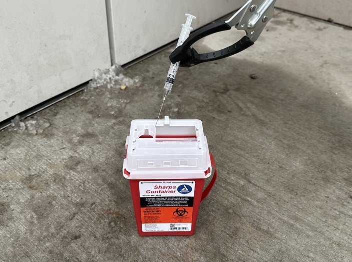 Sharps container for syringe disposal Sharps container for syringe disposal