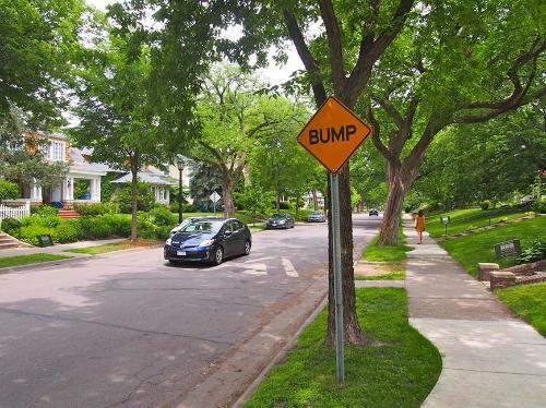A speed bump on a residential street. A speed bump on a residential street.