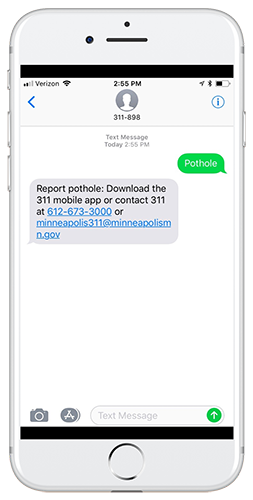 Mobile device showing text message containing instructions for reporting a pothole