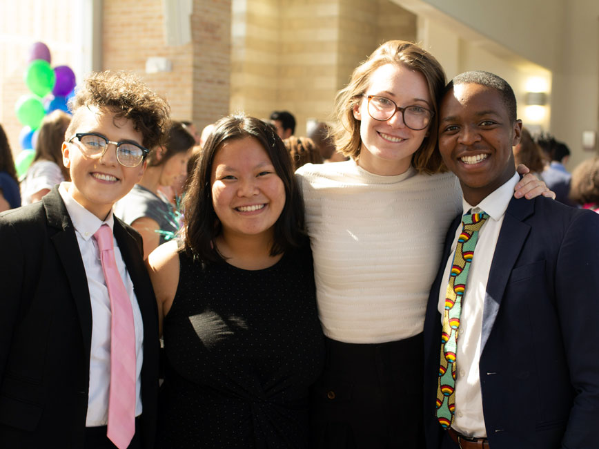 Four students smiling