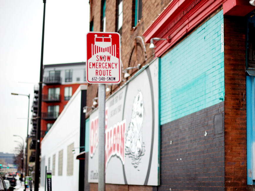 Snow emergency sign by mural