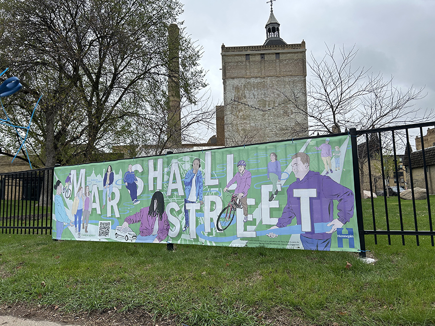 A vinyl mural attached to a railing.