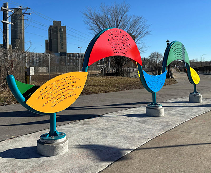A colorful sculpture etched with poetry.