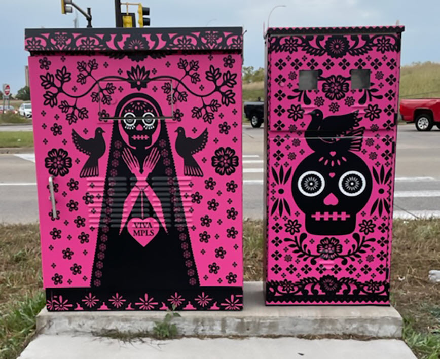 Bright pink and black design on metal boxes.