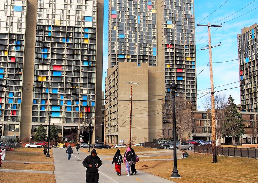 people walking at riverside near riverside plaza
