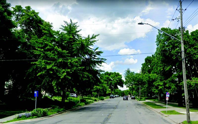 View of street pavement and street light above View of street pavement and street light above