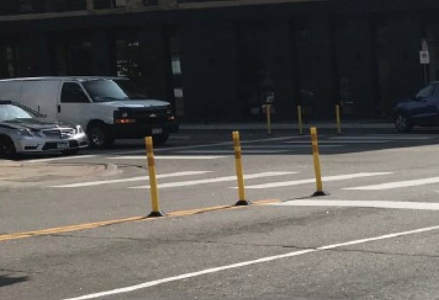 Hardened centerlines - Helps slow vehicles turning left; Improves sight lines between people driving and people crossing the street.
