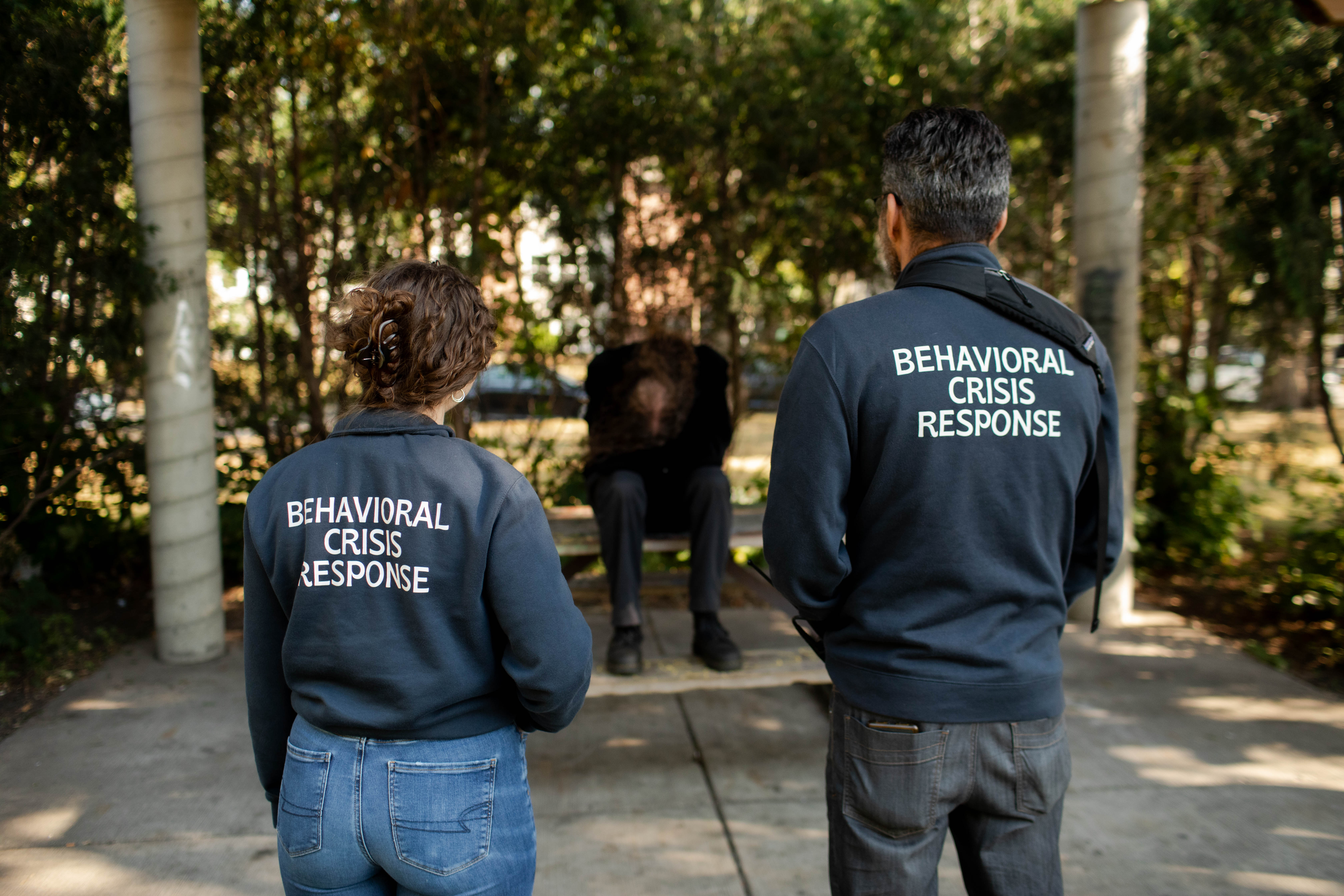 Two BCR employees speaking to a community member