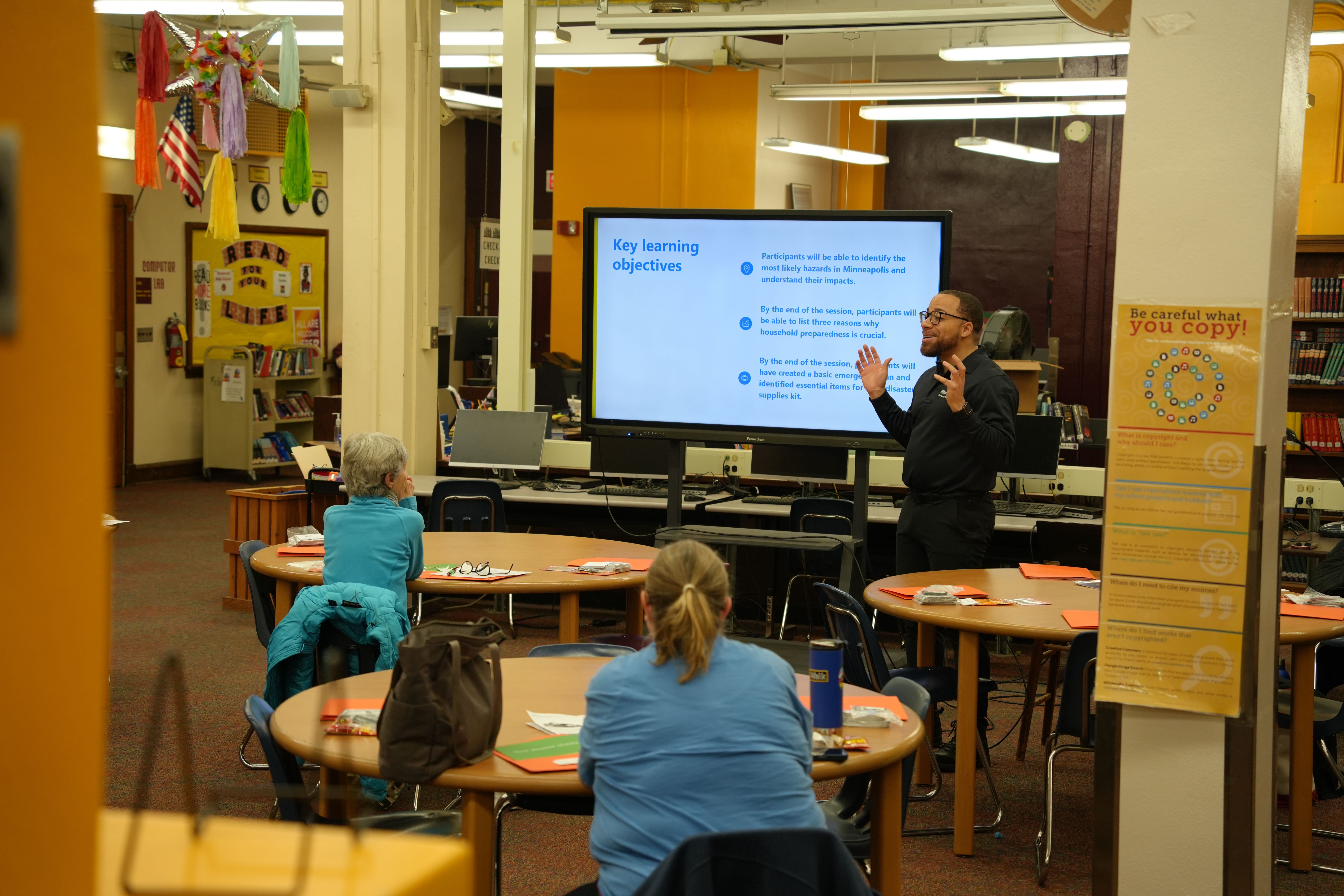 Community members learn about emergency preparedness at the City's Ready Camp.
