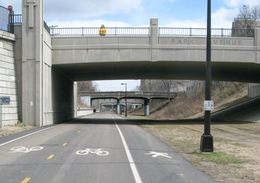 Two-way bike and pedestrian trail that travels under an overpass