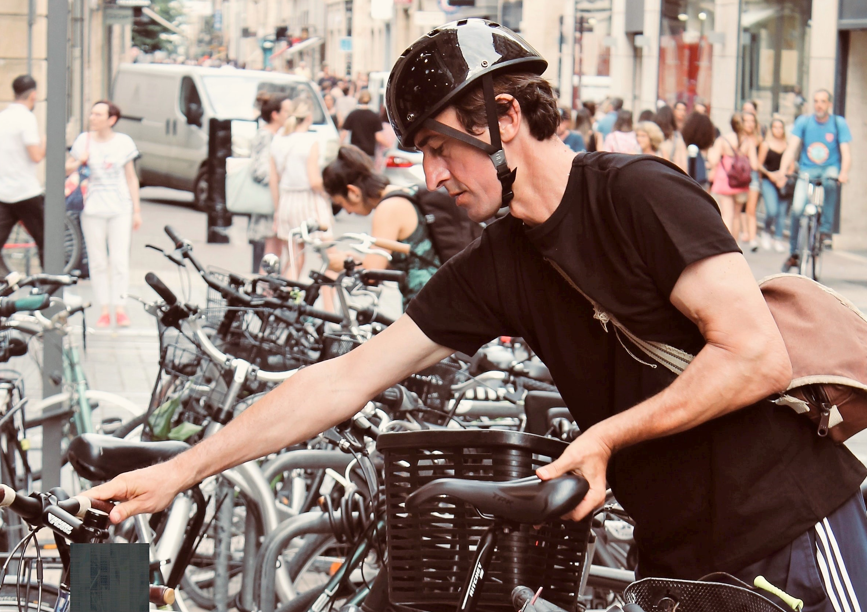 Person parking bike Person parking bike