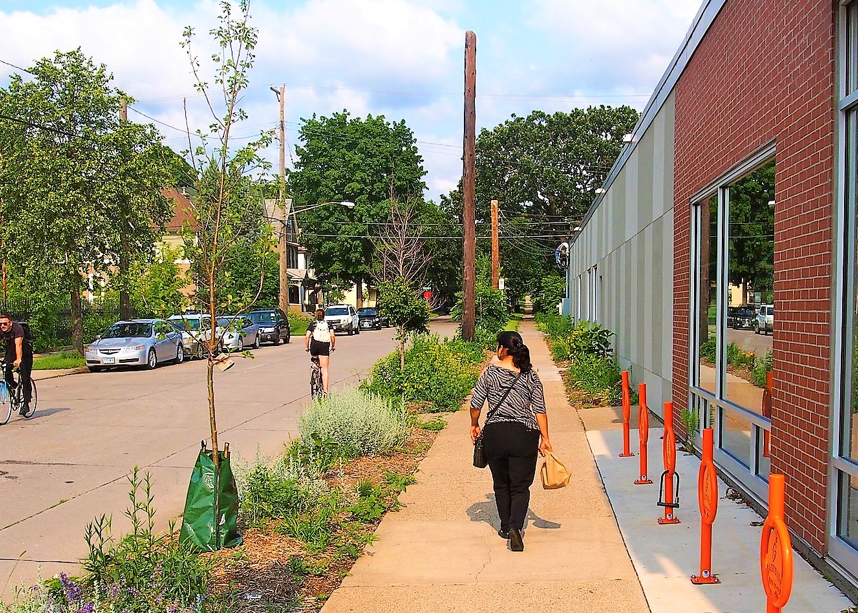 person walking down sidewalk