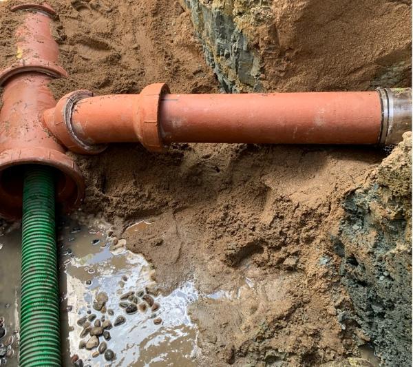 Two ground pipes connecting in a T Two ground pipes connecting in a T