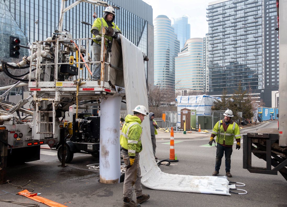 Contractor with a large pipe liner in the street. Contractor with a large pipe liner in the street.