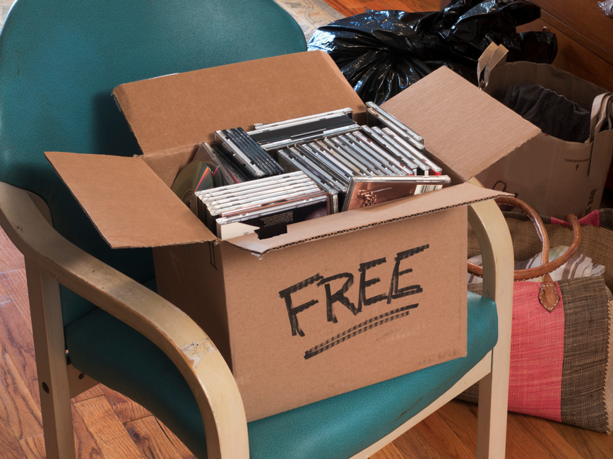 A box of free CDs and other items