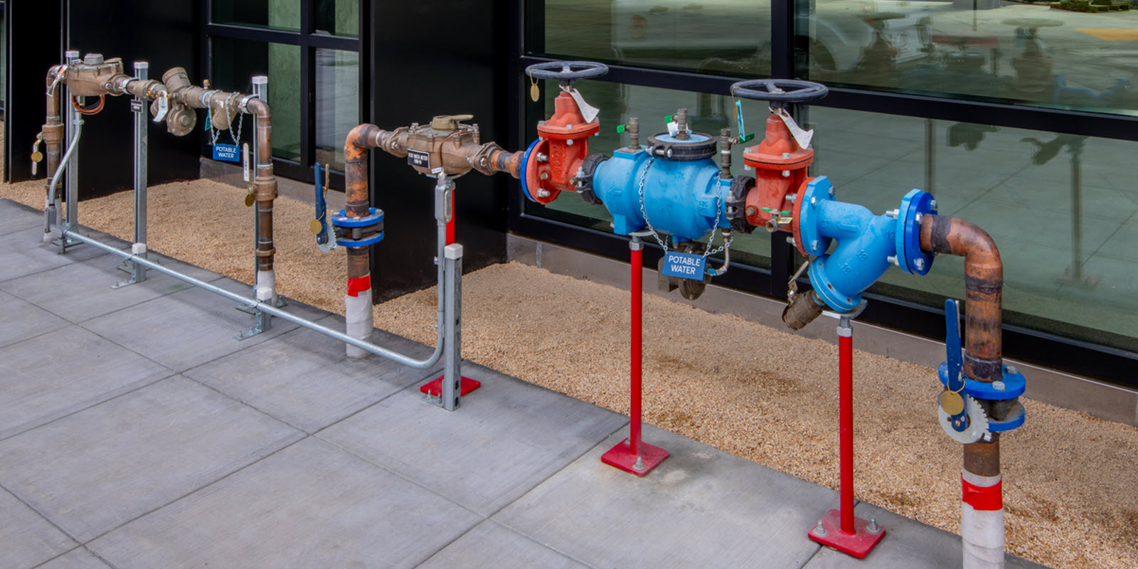 Plumber testing backflow prevention at city water system