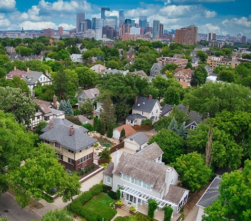 Minneapolis neighborhood with skyline in background Minneapolis neighborhood with skyline in background