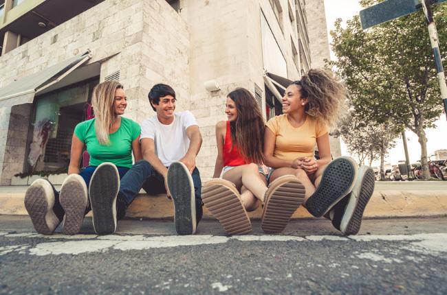 Four teenagers smiling together