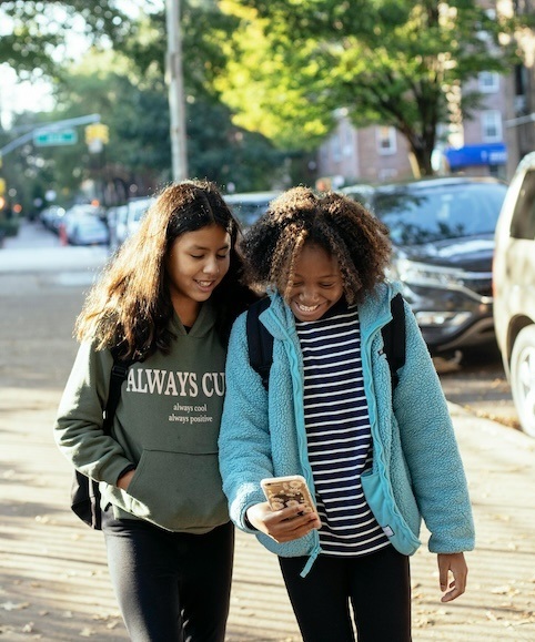 Two teenagers smiling together outside Two teenagers smiling together outside