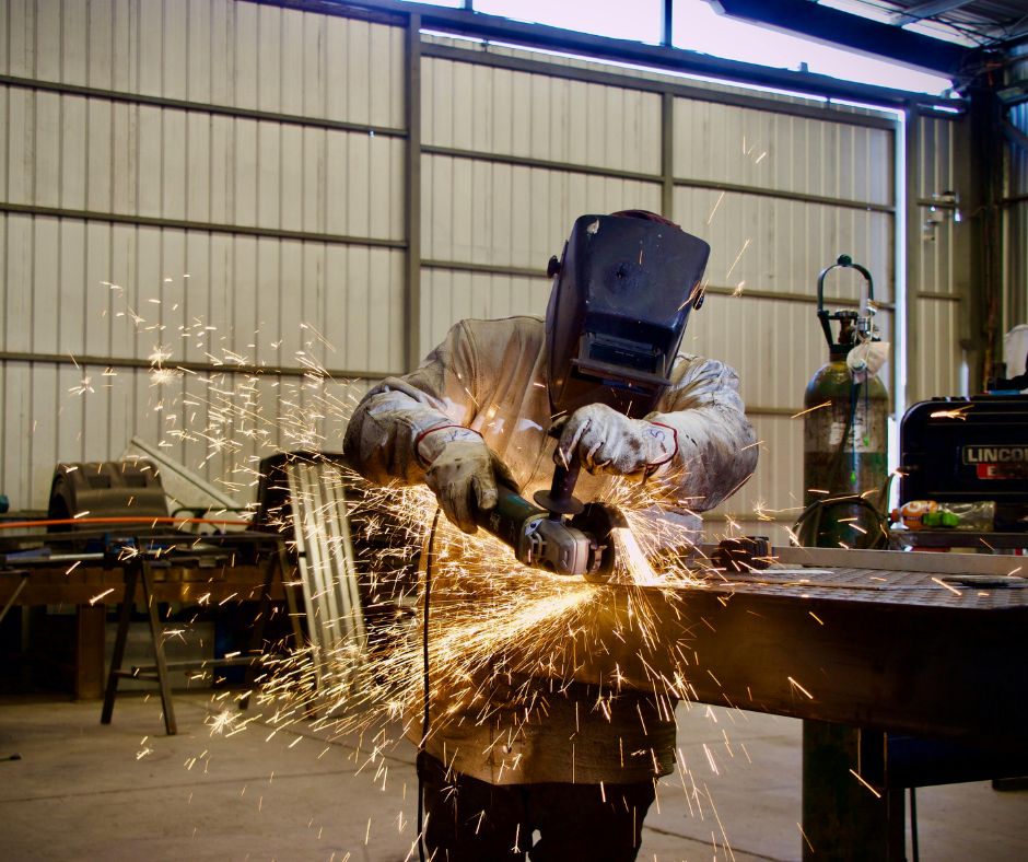 A welder in a garage