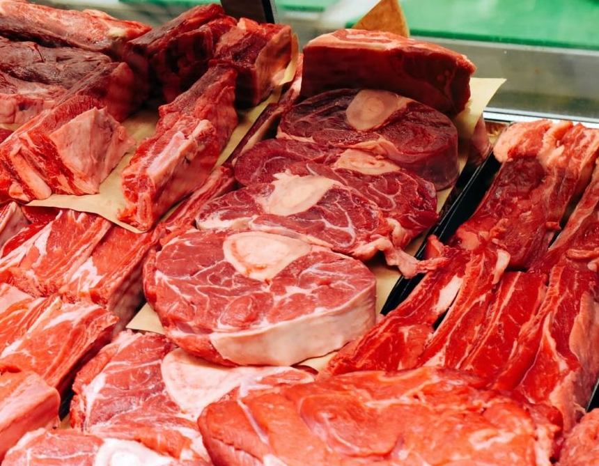 Meat in a butcher shop display counter.